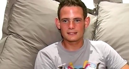 Handsome UK jock Jason uses both hands for his long dick