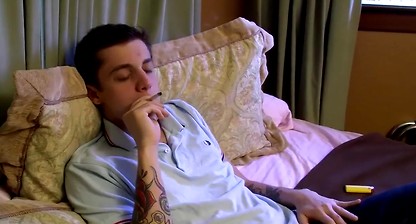 Inked bad boy Chris Porter smokes cigars while masturbating