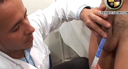 The campus doctor measures the Latino boy's uncut cock